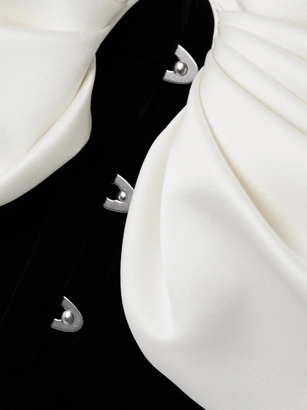 Close-up detail of the Costarellos Rosamund Bow-detailed Lace-up Crepe and Velvet Bustier Top