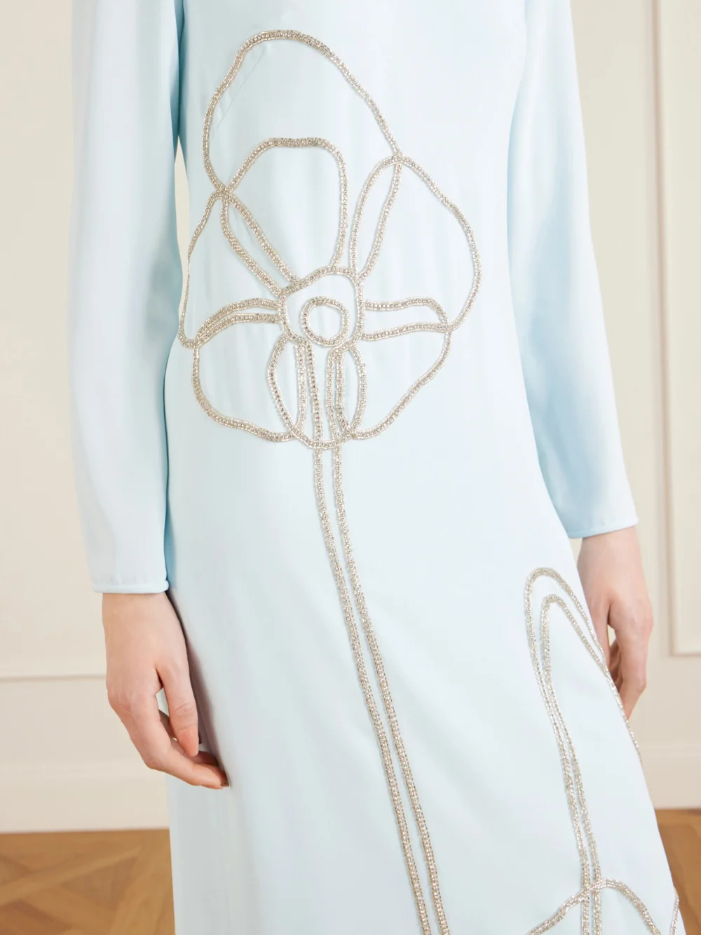 Close-up detail of the Costarellos Zarie Crystal-embellished Crepe Gown