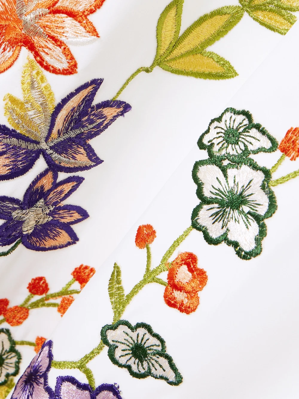 Close-up detail of the Costarellos Zinnia Embroidered Crepe Gown