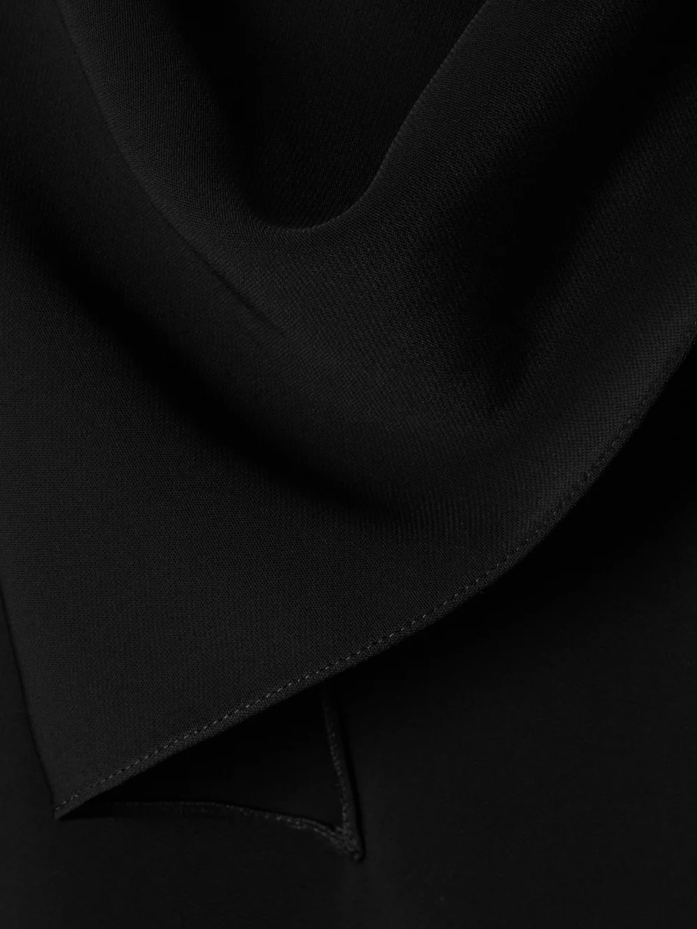 Close-up detail of the Courrèges Asymmetric Knotted Satin Midi Dress