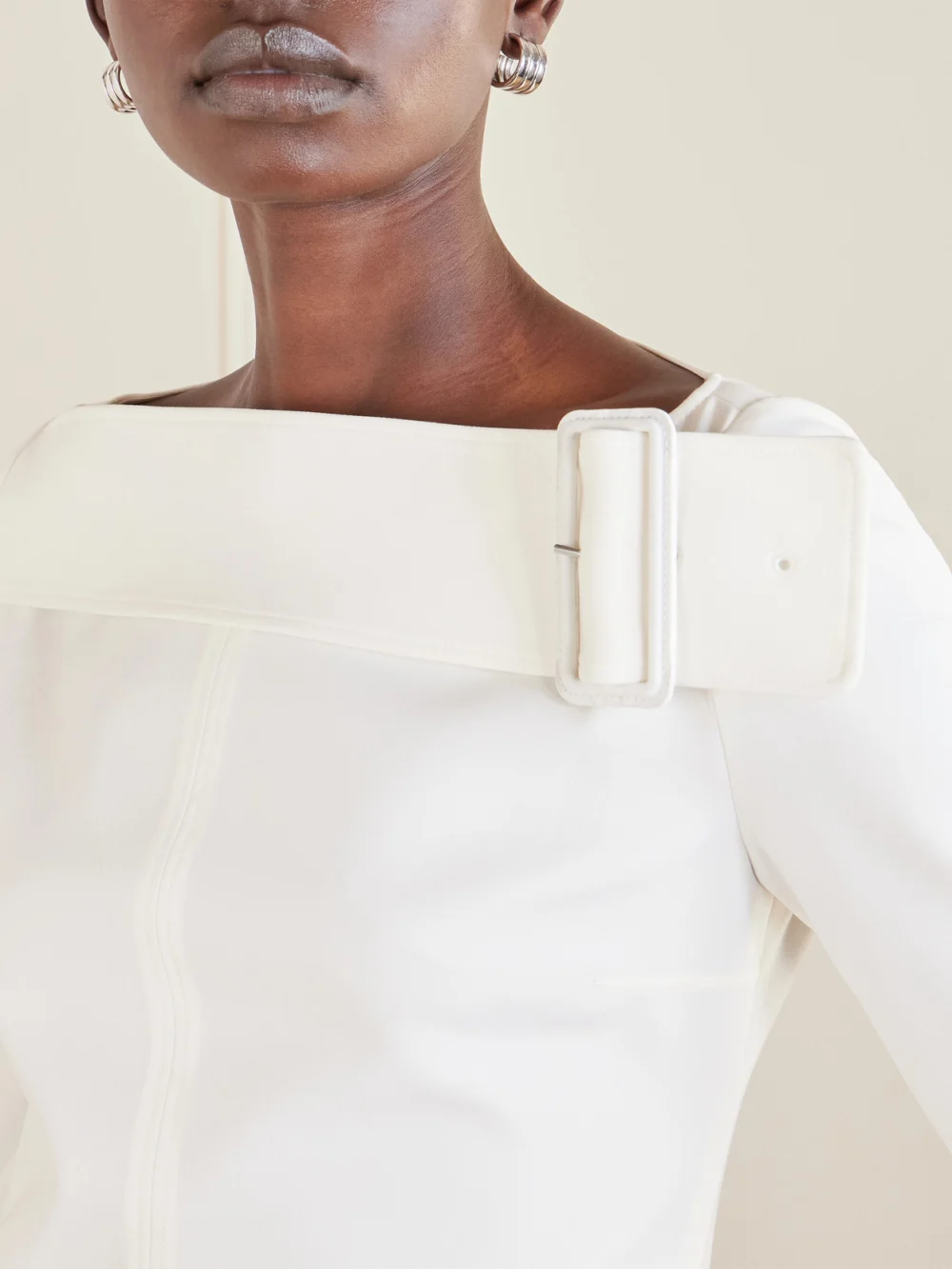Close-up detail of the Courrèges Buckled Crepe Mini Dress