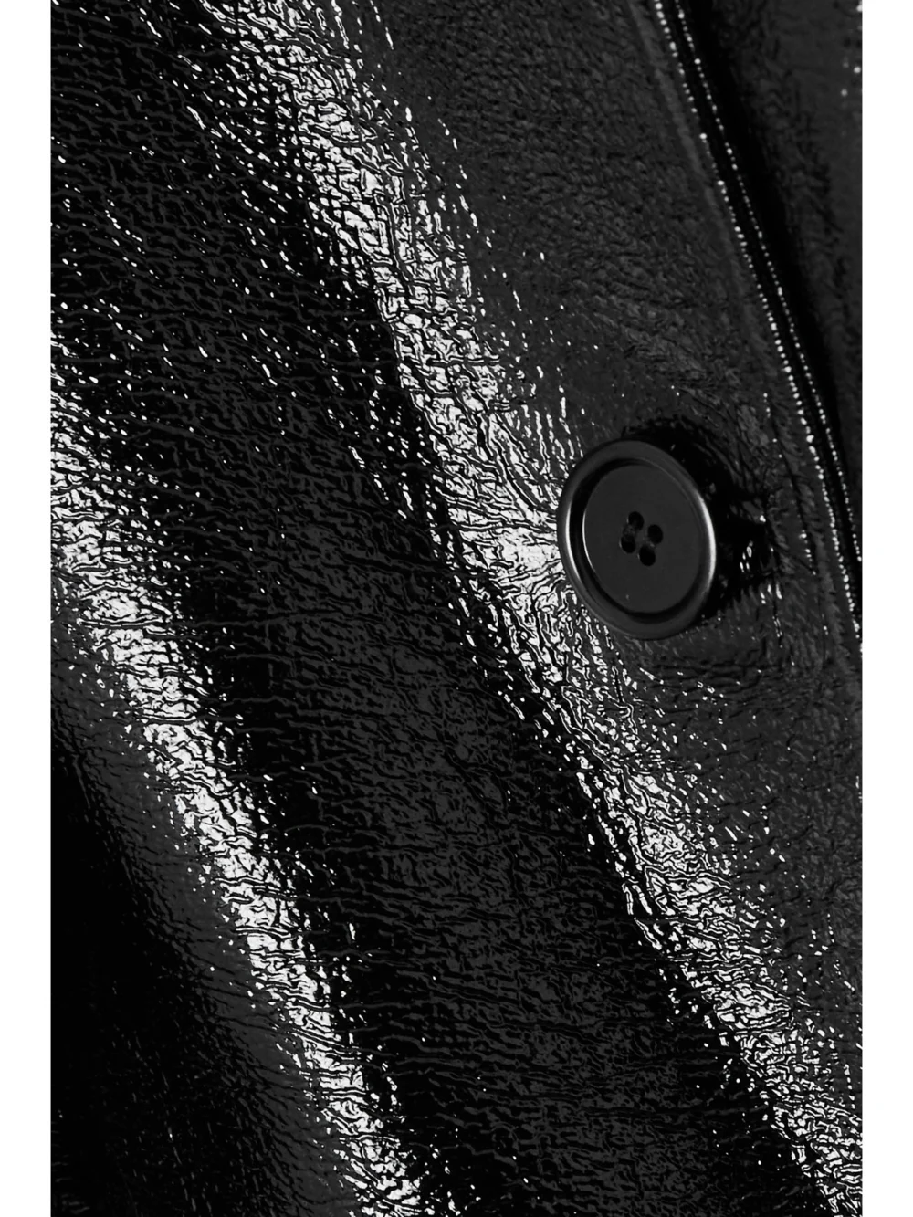 Close-up detail of the Courrèges Cocoon Convertible Coated Cotton-blend Jacket