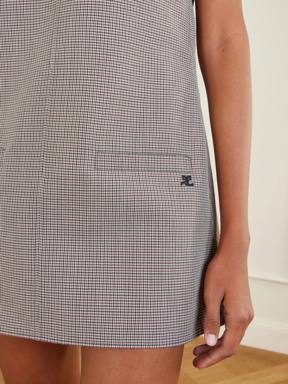 Close-up detail of the Courrèges Heritage Houndstooth Wool-blend Mini Dress