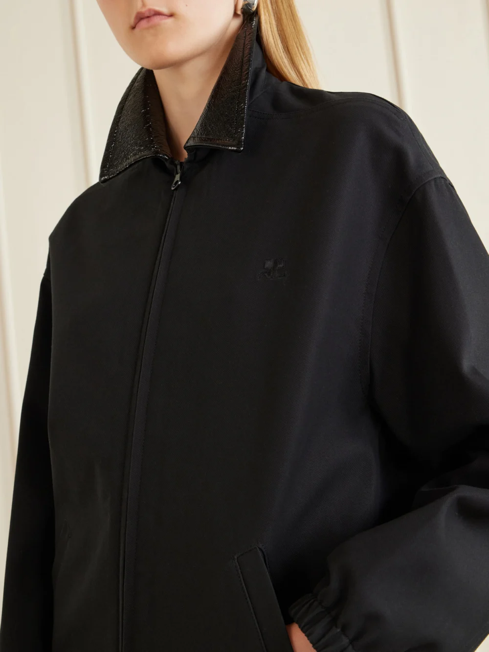 Close-up detail of the Courrèges Logo-embroidered Cotton Canvas Bomber Jacket