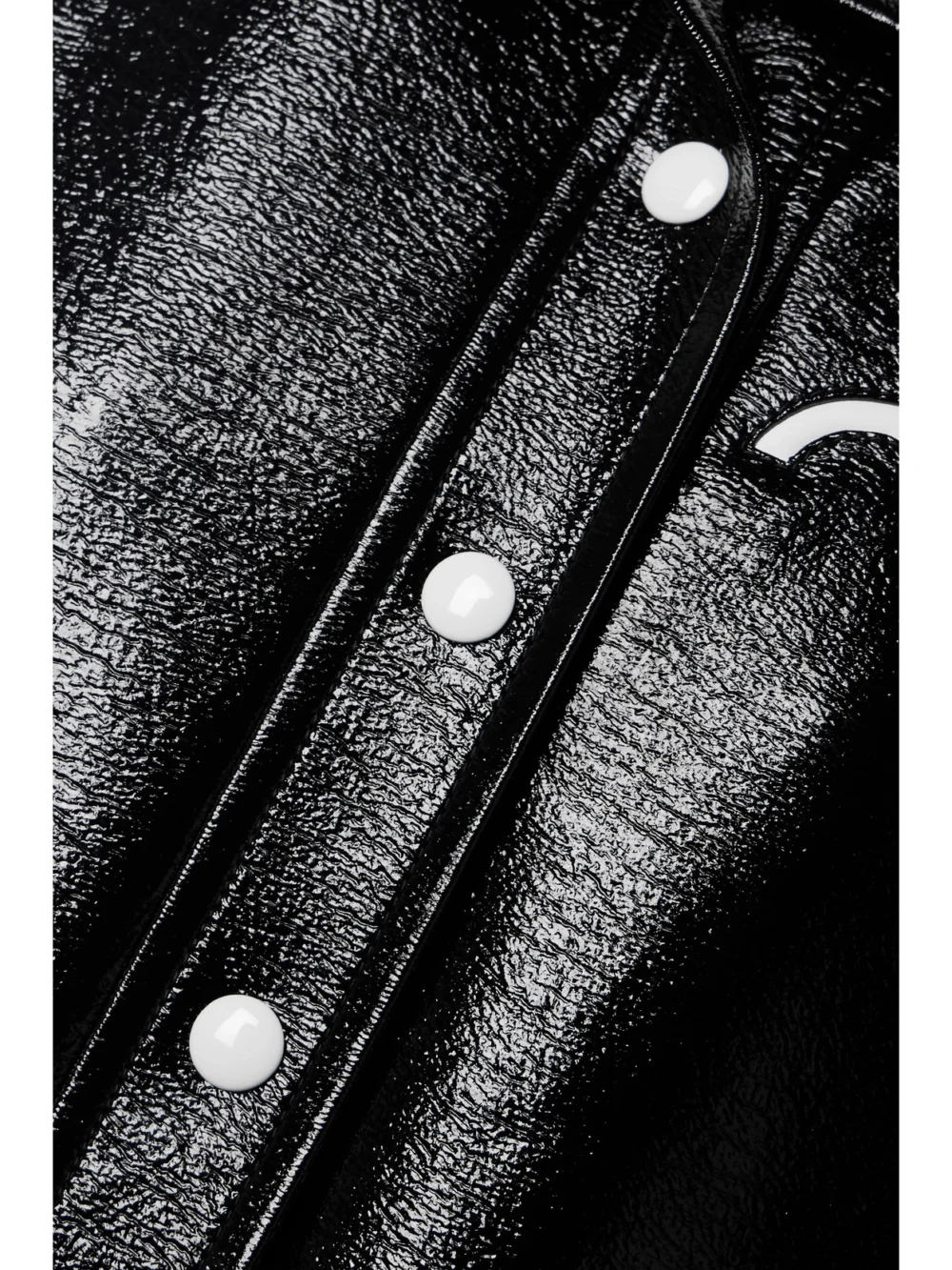 Close-up detail of the Courrèges Reedition Coated Cotton-blend Jacket