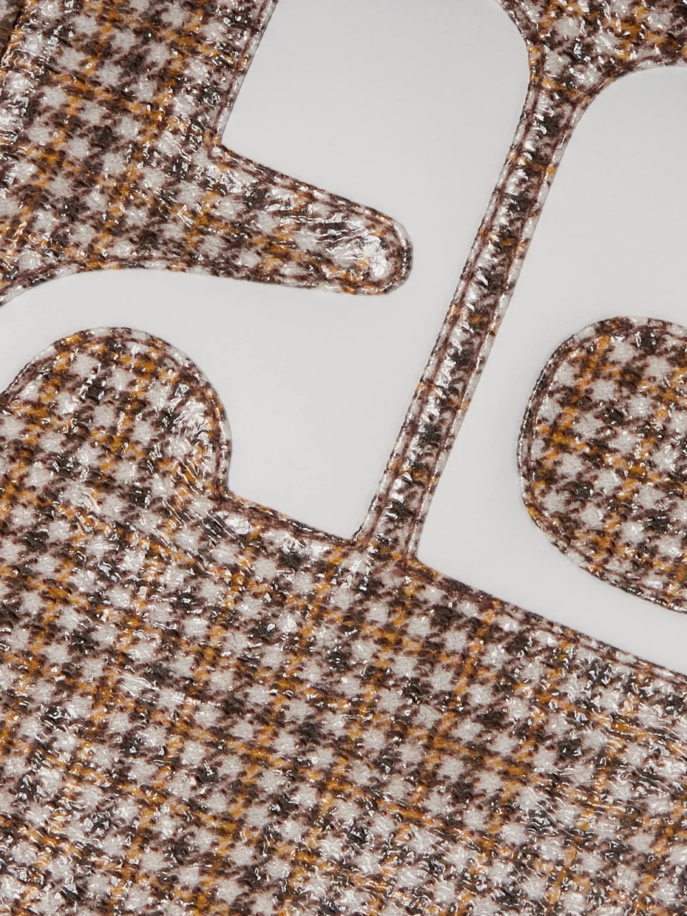 Close-up detail of the Courrèges Reedition Cropped Appliquéd Checked Coated Cotton-blend Jacket