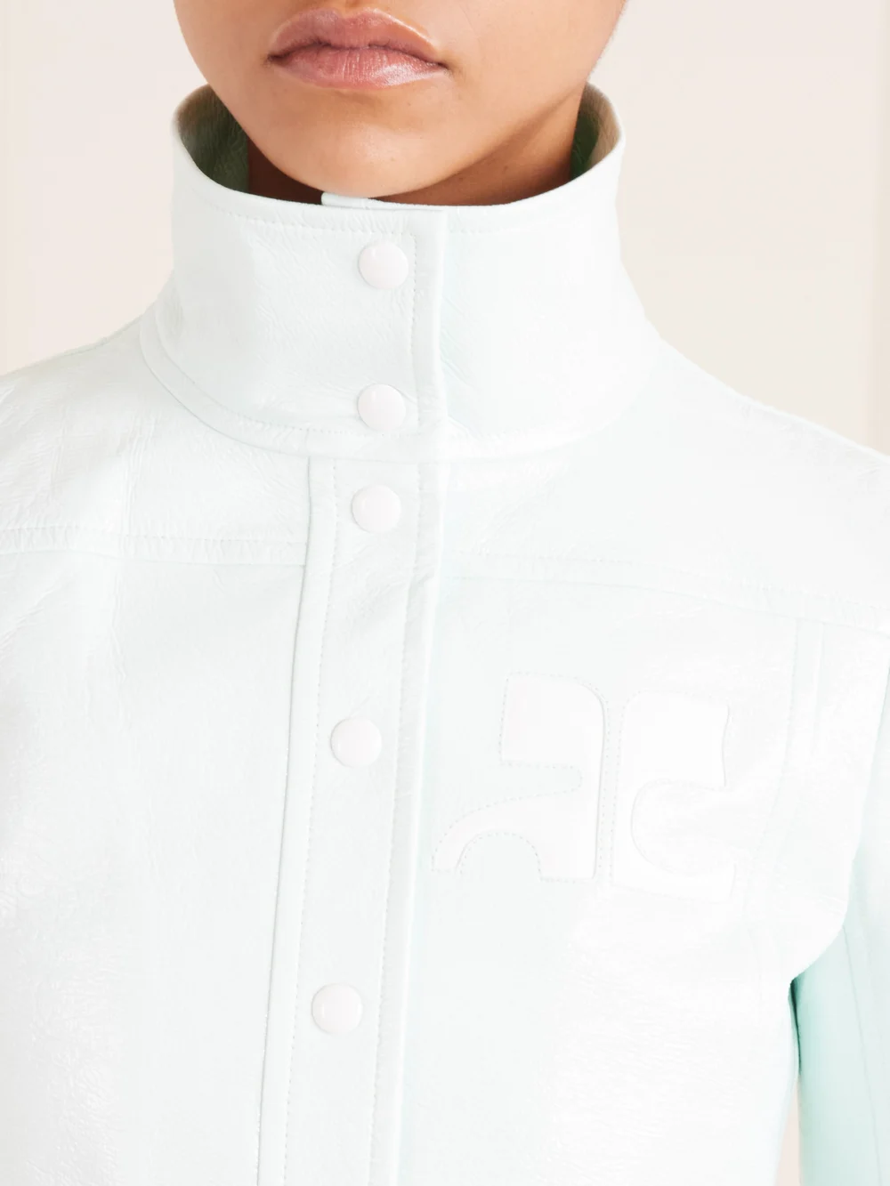 Close-up detail of the Courrèges Reeditioncropped Coated Cotton-blend Jacket
