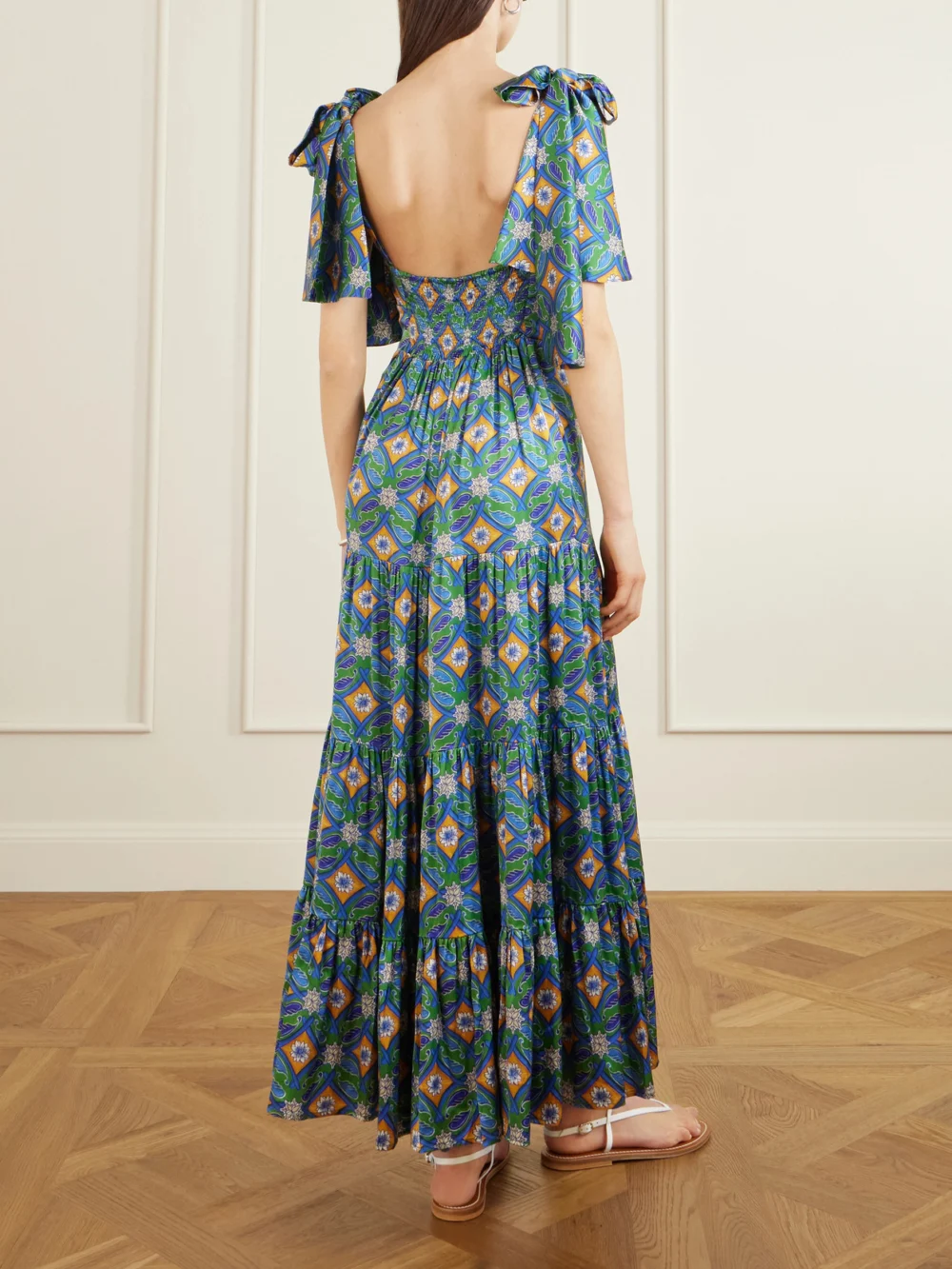 Back view of the Cristiano Marcheli Donatella Tie-detailed Tiered Printed Silk-blend Satin Maxi Dress