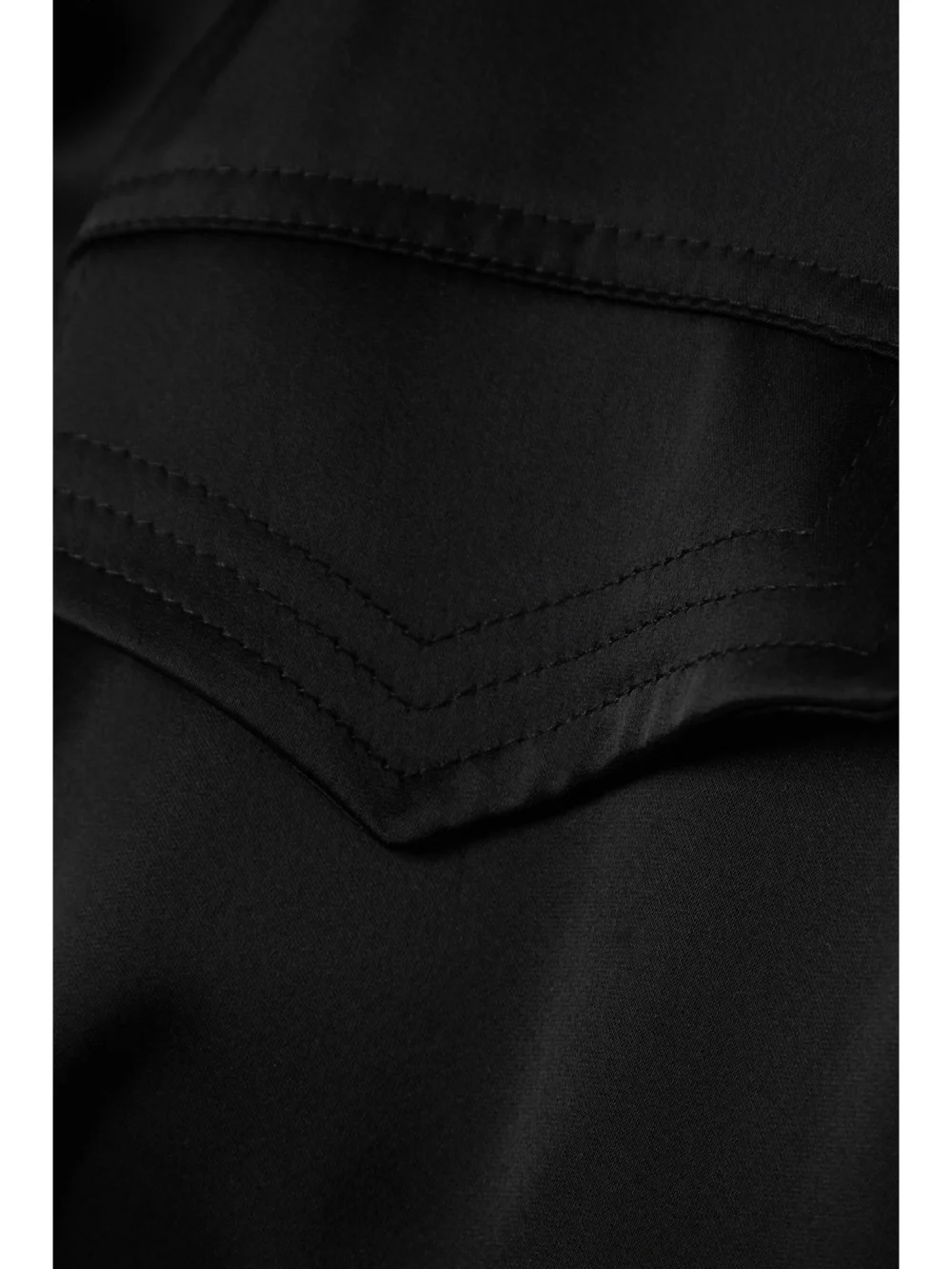 Close-up detail of the David Koma Ruffled Satin Wrap Gown