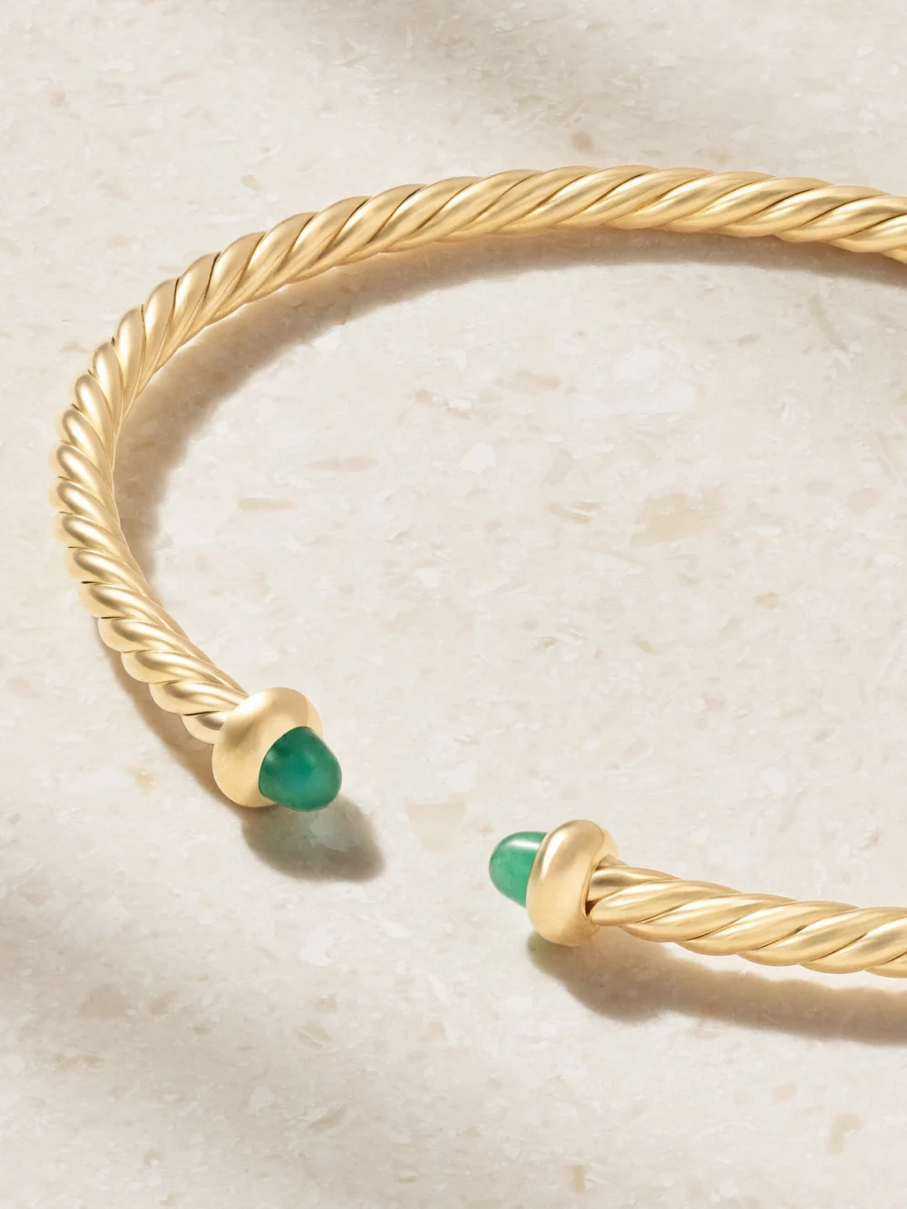 Close-up detail of the David Yurman Micro Cablespira Flex 18-karat Gold Emerald Bangle
