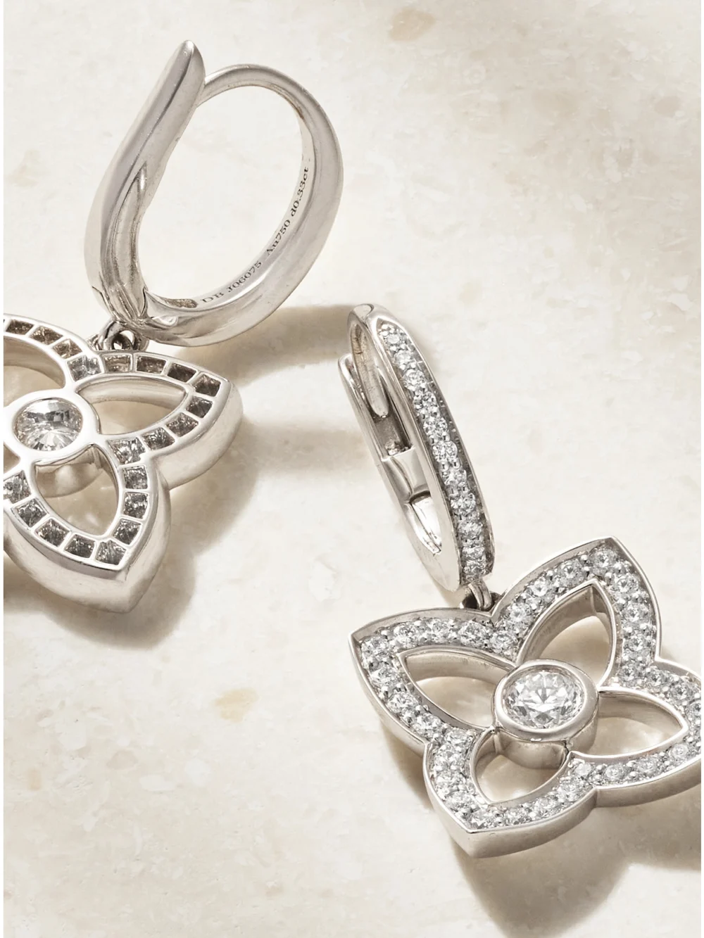 Close-up detail of the De Beers London Lotus By De Beers 18-karat White Gold Diamond Earrings