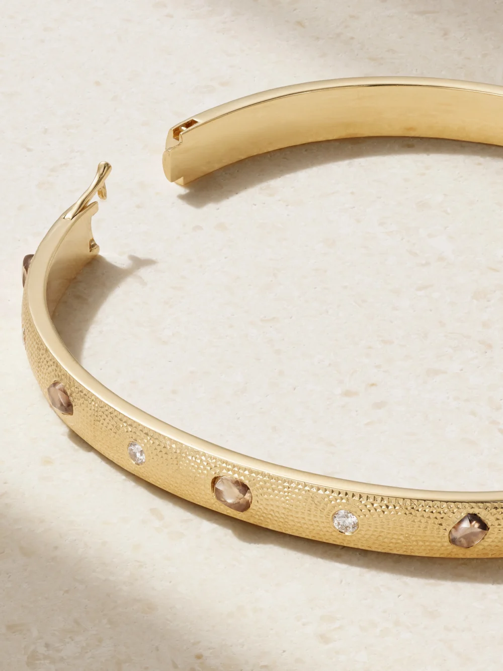 Close-up detail of the De Beers London Talisman 18-karat Gold Diamond Bangle