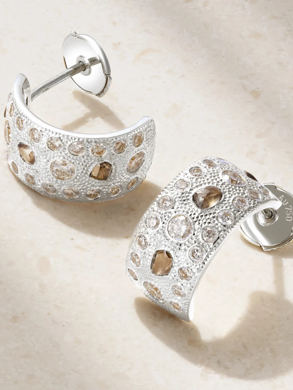 Close-up detail of the De Beers London Talisman 18-karat White Gold Diamond Hoop Earrings