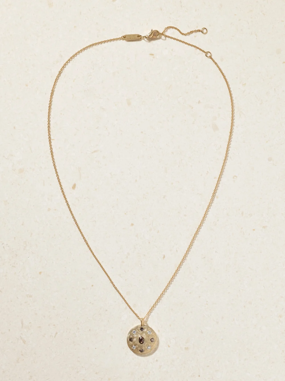Close-up detail of the De Beers London Talisman Medal 18-karat Gold Diamond Necklace