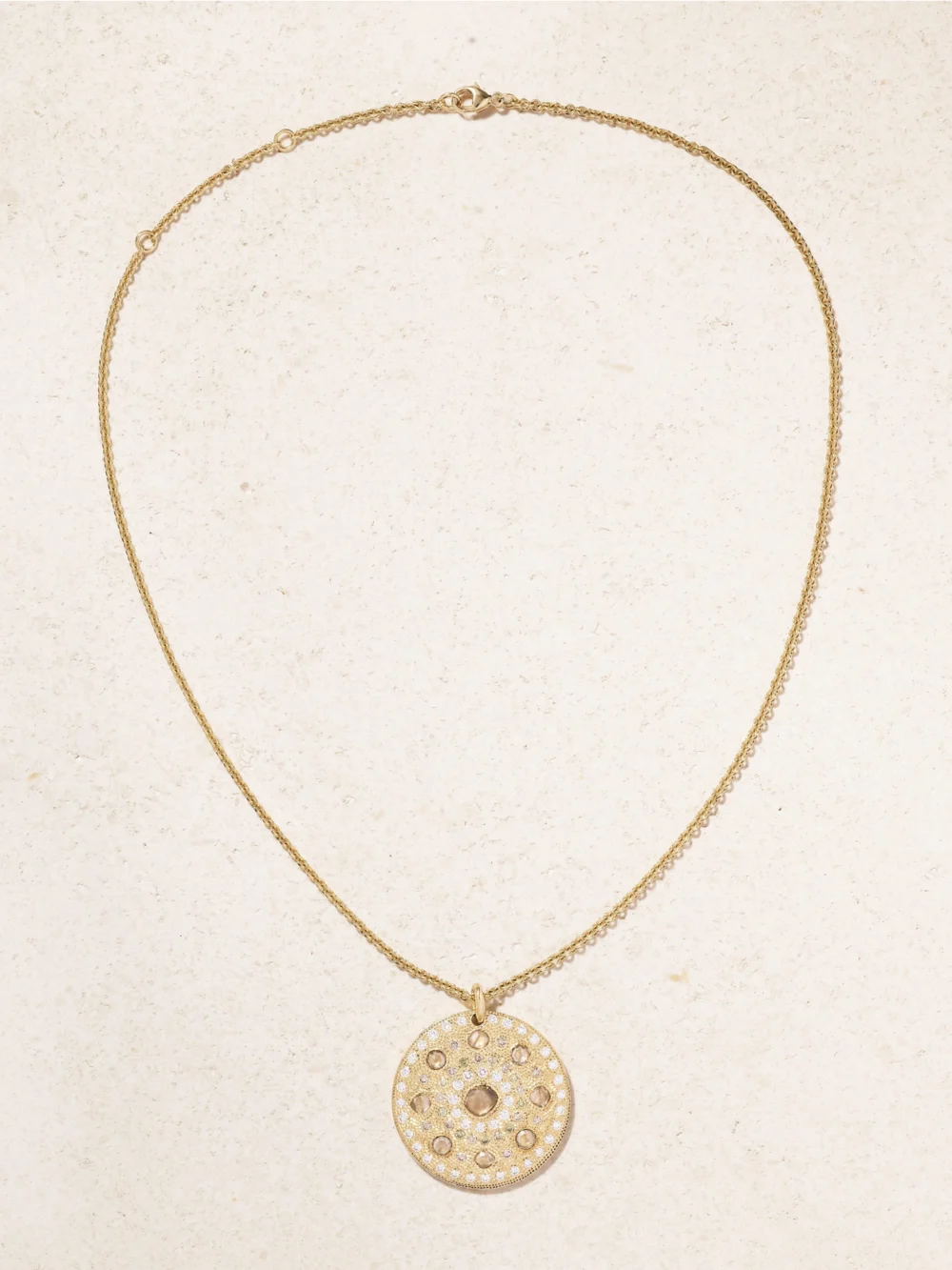 Close-up detail of the De Beers London Talisman Medal Large 18-karat Gold Diamond Necklace