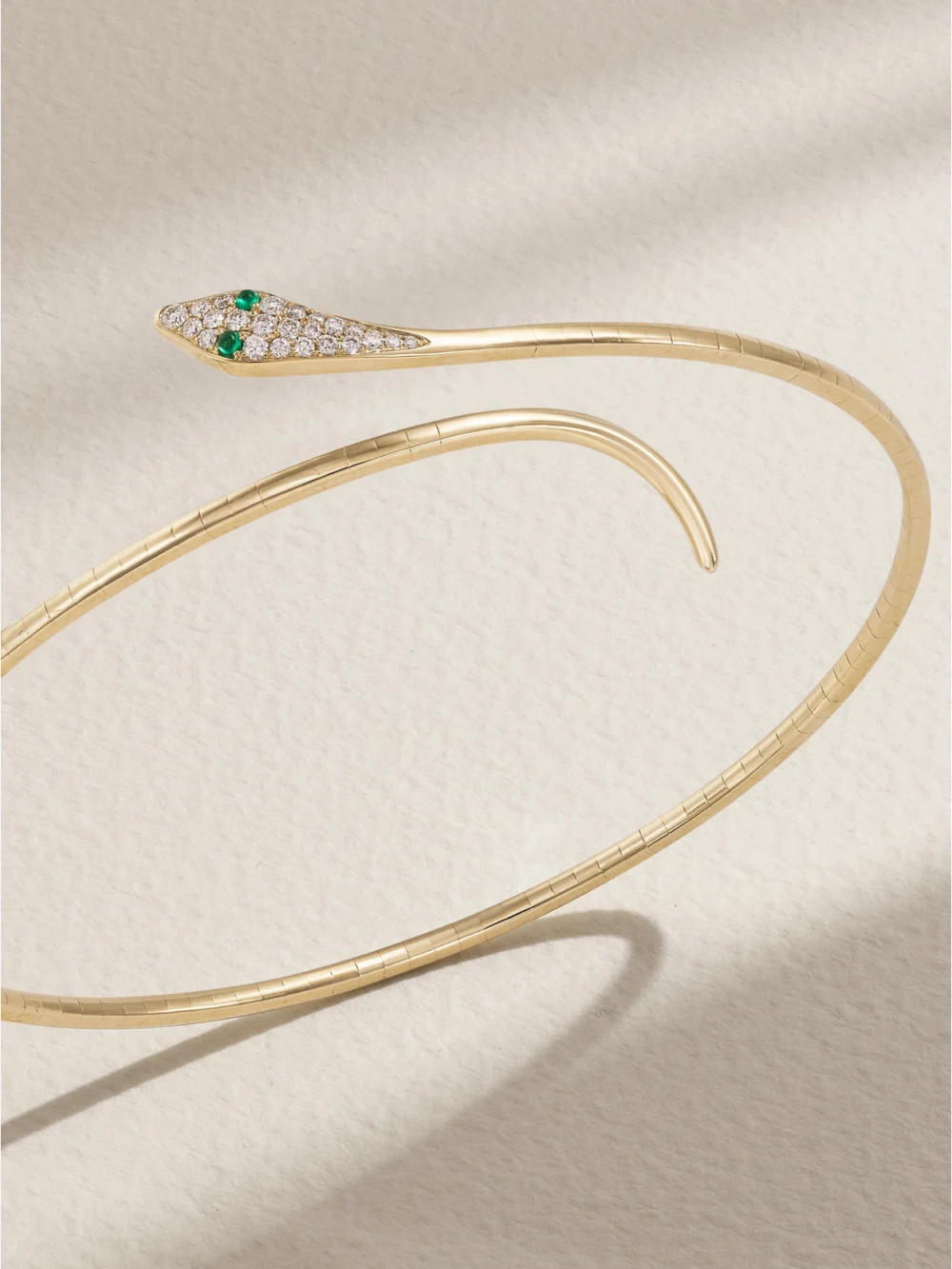 Close-up detail of the Diane Kordas Snake 9-karat Gold, Emerald and Diamond Arm Cuff