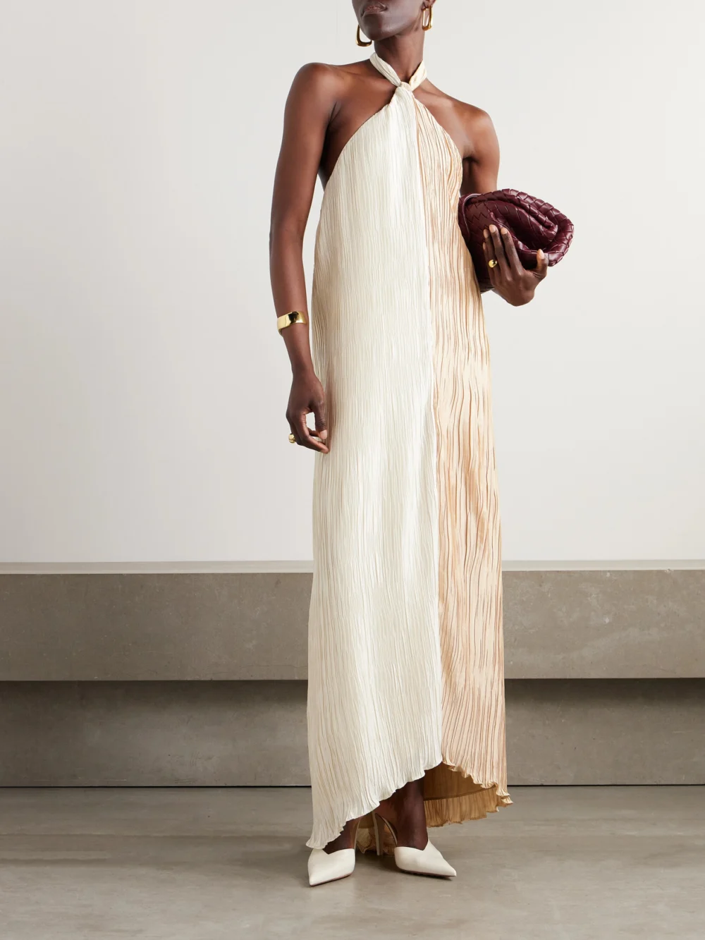 Dima Ayad Knotted Plissé-satin Halterneck Maxi Dress, worn by a model