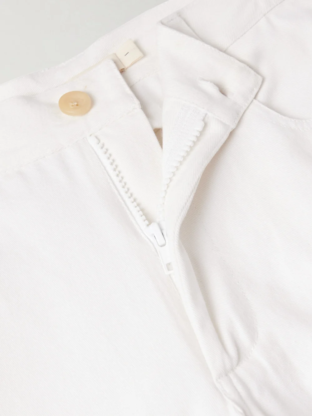 Close-up detail of the Diotima Stulla Crochet-trimmed Mid-rise Straight-leg Jeans