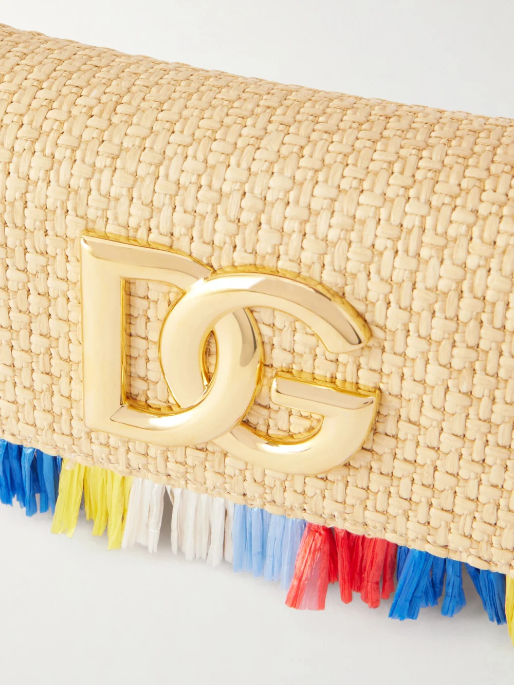 Close-up detail of the Dolce & Gabbana 3.5 Logo-embellished Fringed Leather-trimmed Raffia Shoulder Bag