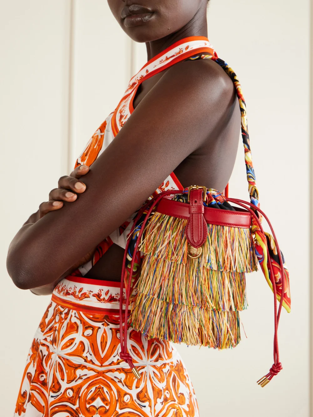 Dolce & Gabbana Capri Fringed Leather and Twill-trimmed Raffia Bucket Bag, styled view