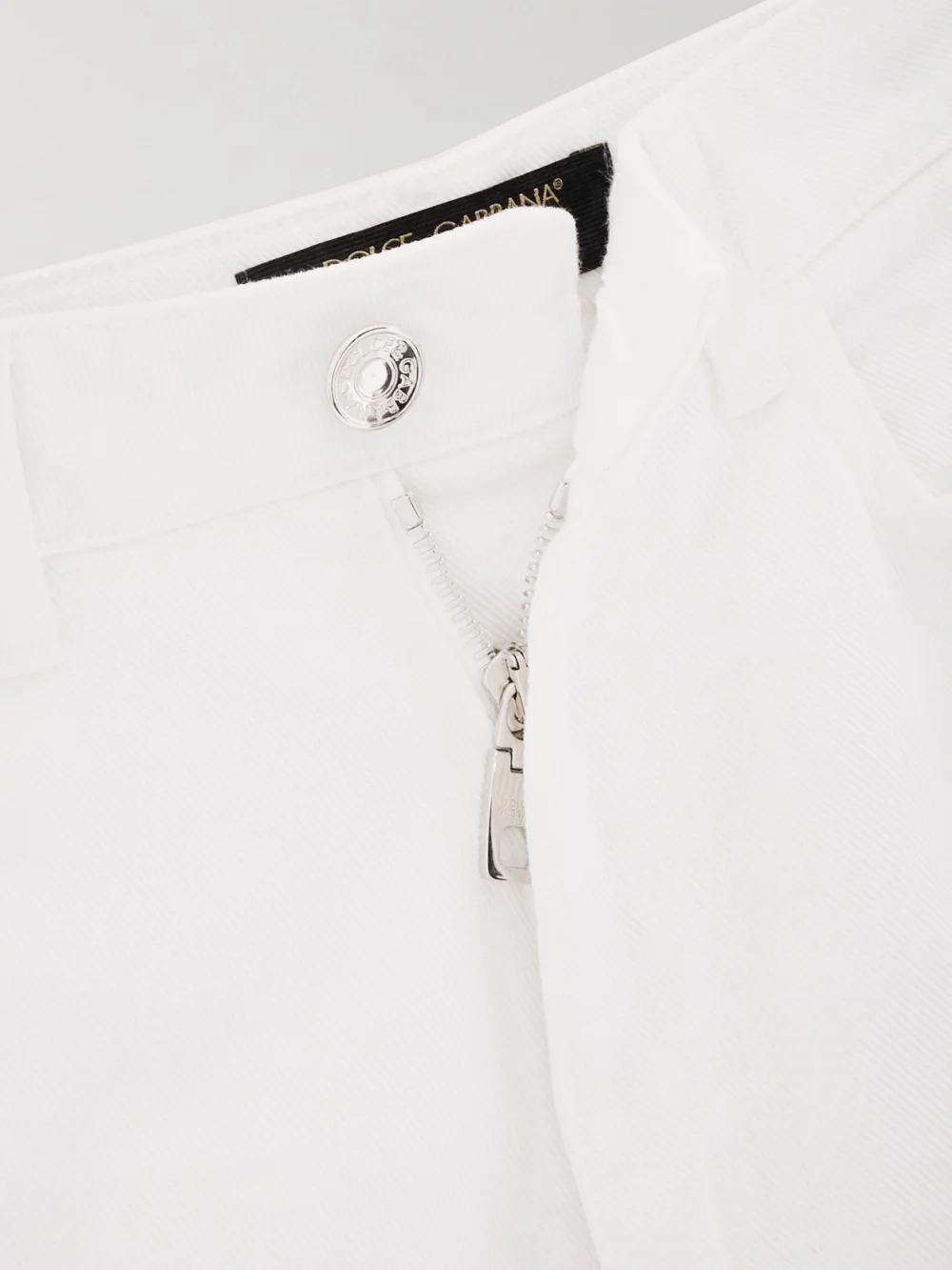 Close-up detail of the Dolce & Gabbana Cotton-twill Flared Pants