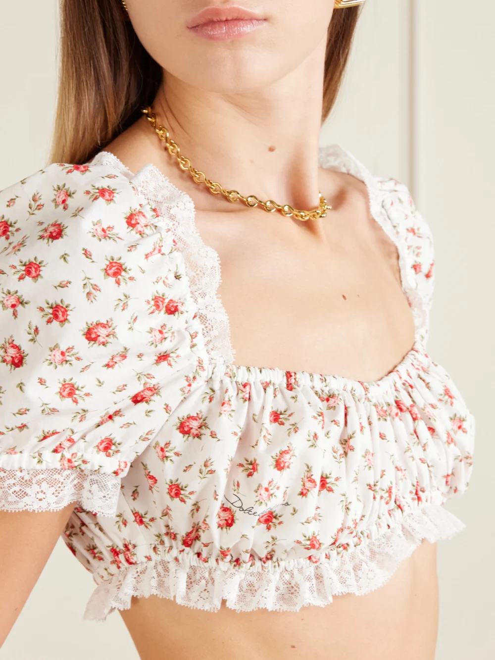 Close-up detail of the Dolce & Gabbana Cropped Printed Lace-trimmed Cotton-blend Poplin Top