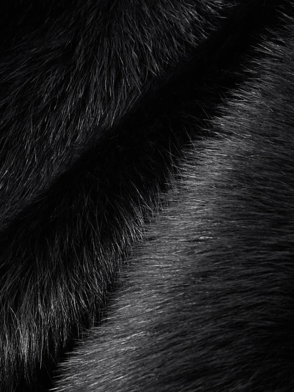 Close-up detail of the Dolce & Gabbana Cropped Satin-trimmed Shearling Jacket