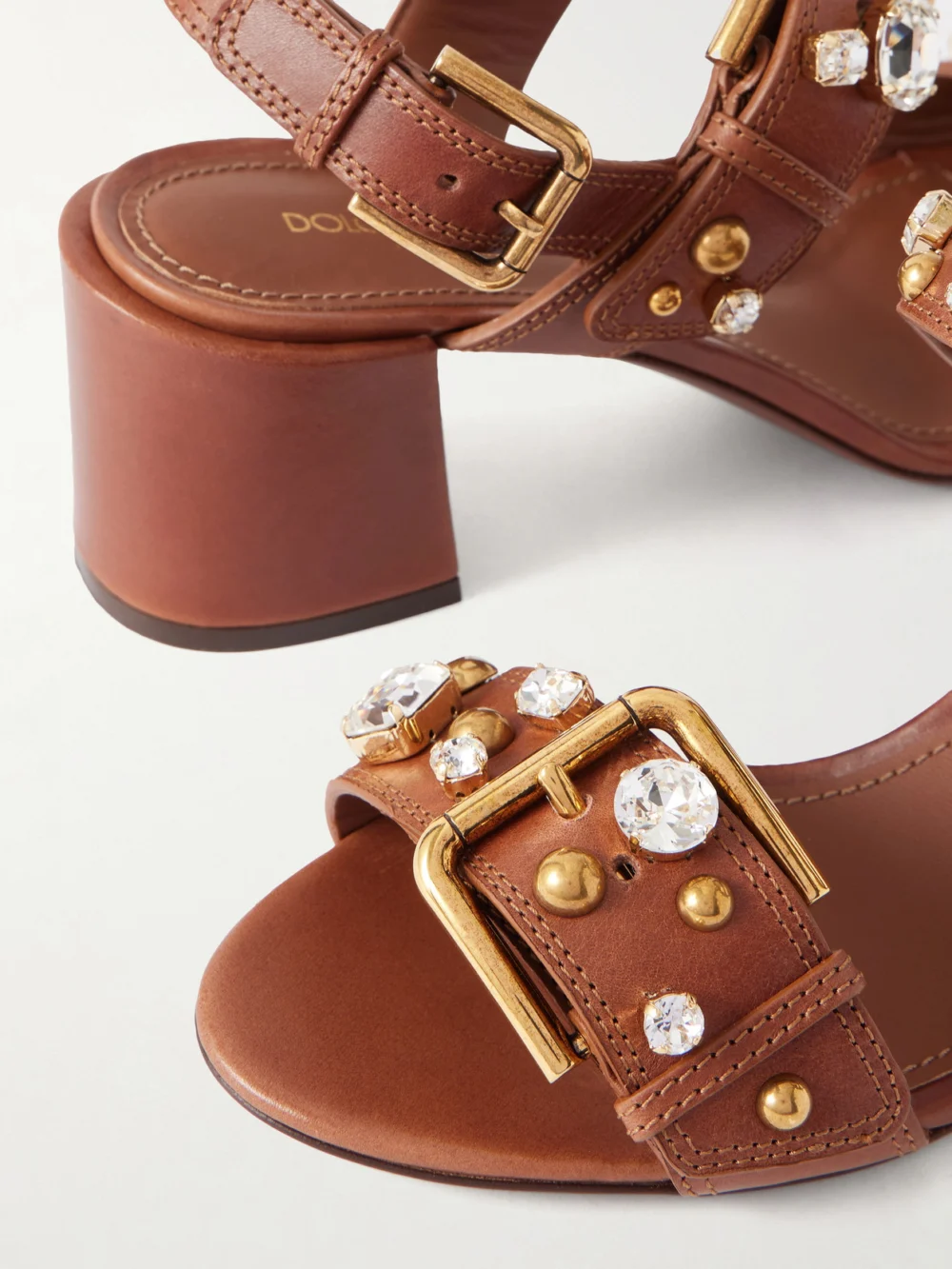 Close-up detail of the Dolce & Gabbana Embellished Leather Slingback Sandals