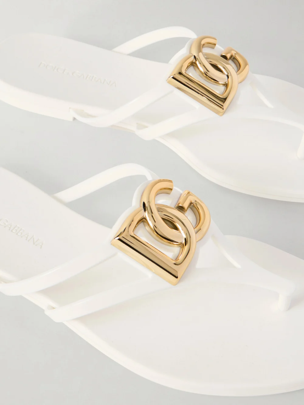 Close-up detail of the Dolce & Gabbana Embellished Rubber Flip Flops