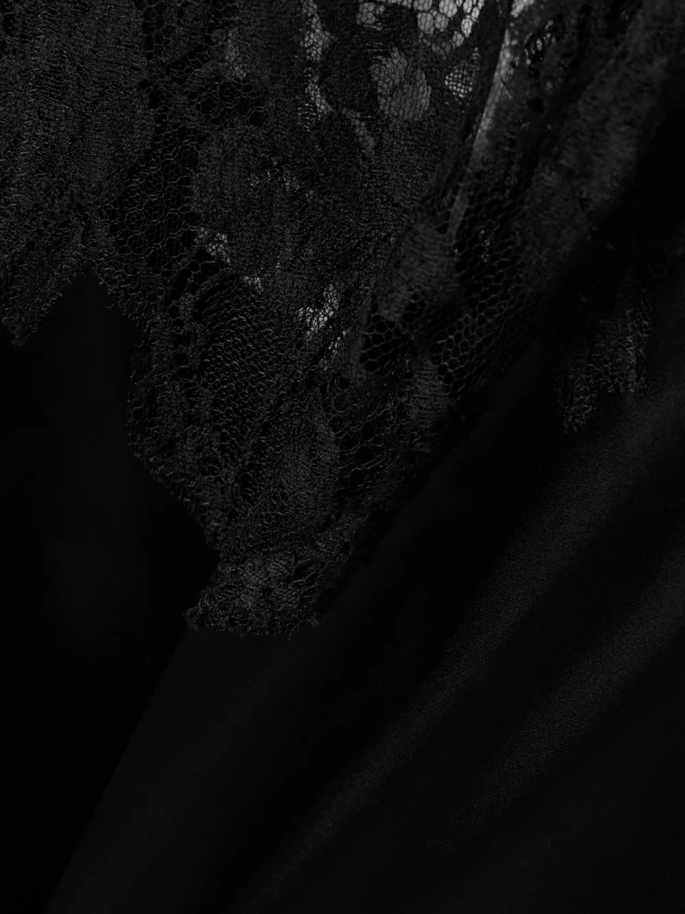 Close-up detail of the Dolce & Gabbana Lace-trimmed Satin Mini Dress
