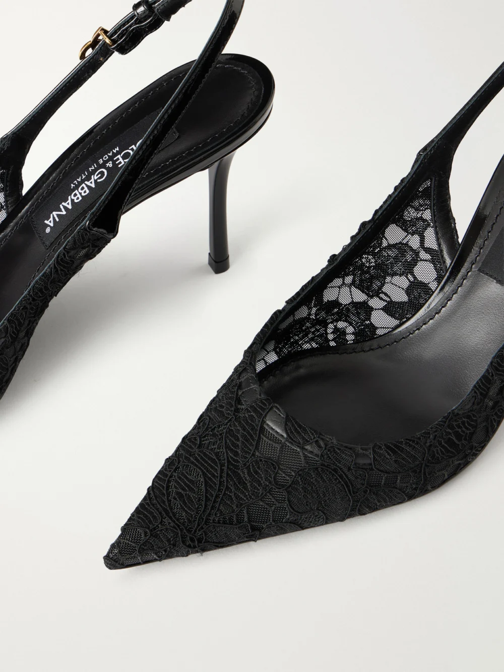 Close-up detail of the Dolce & Gabbana Logo-detailed Patent Leather-trimmed Lace Slingback Pumps