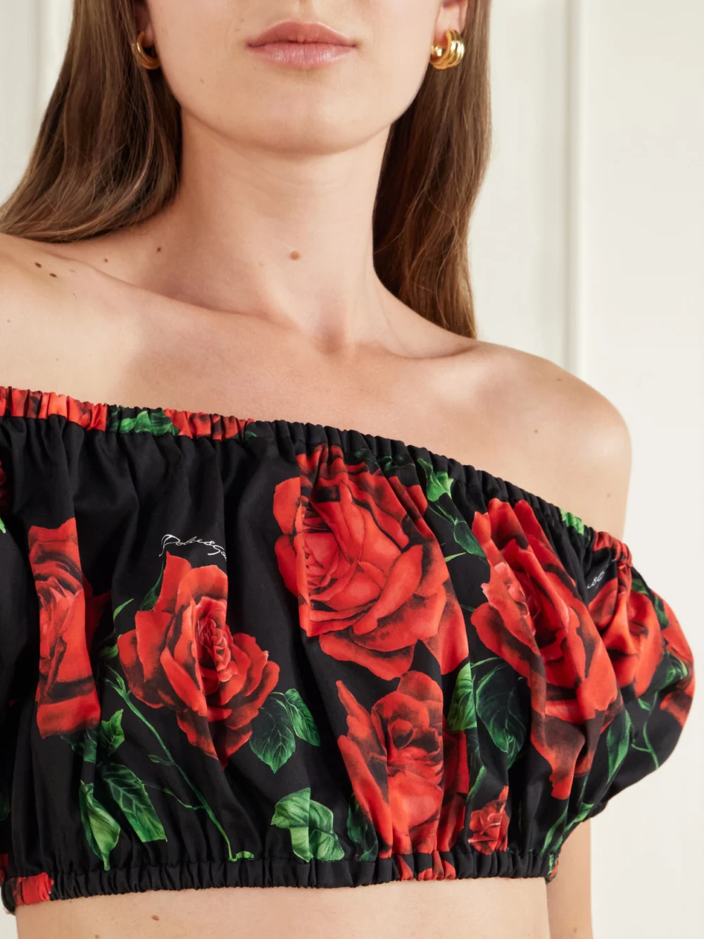 Close-up detail of the Dolce & Gabbana Off-the-shoulder Cropped Floral-print Cotton-poplin Top