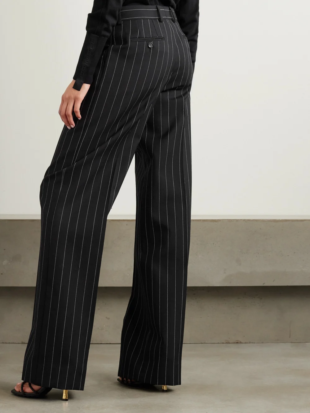 Back view of the Dolce & Gabbana Pinstriped Wool Wide-leg Pants