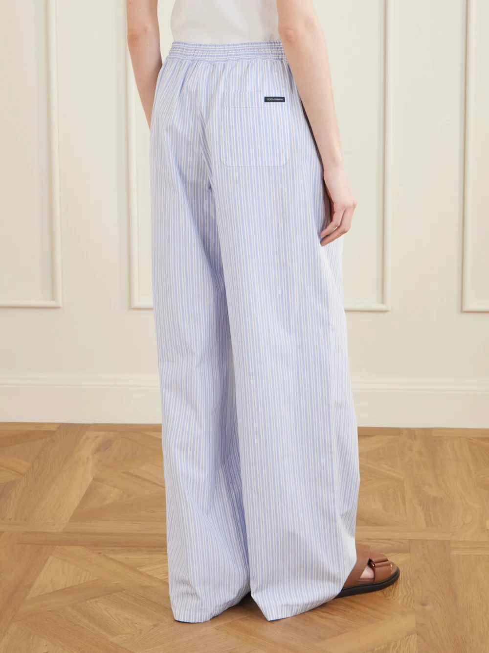 Back view of the Dolce & Gabbana Pleated Striped Cotton-poplin Wide-leg Pants
