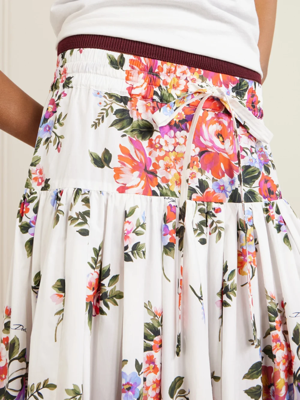 Close-up detail of the Dolce & Gabbana Pleated Tiered Floral-print Cotton-poplin Midi Skirt