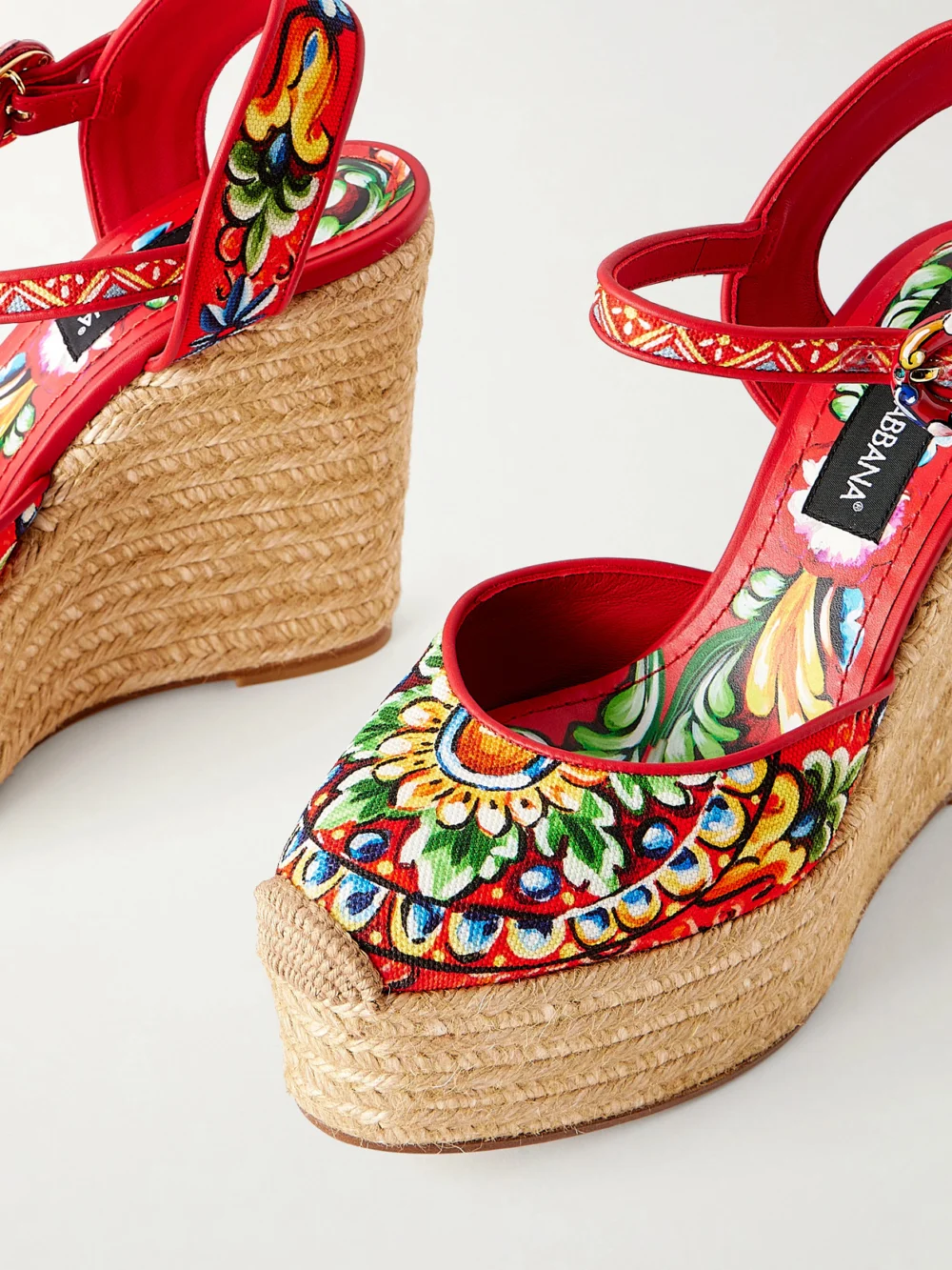 Close-up detail of the Dolce & Gabbana Printed Leather-trimmed Canvas Wedge Sandals