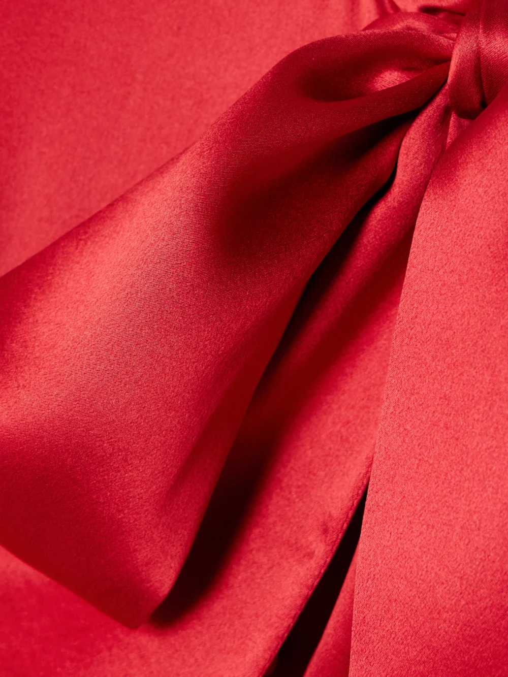 Close-up detail of the Dolce & Gabbana Pussy-bow Smocked Pleated Silk-satin Midi Dress