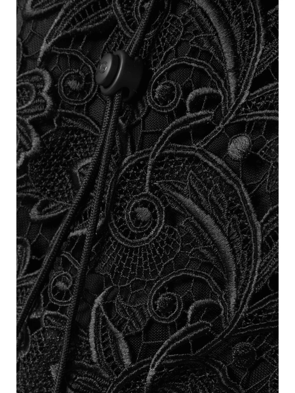 Close-up detail of the Dolce & Gabbana Quilted Nylon, Satin and Macramé Lace Half-zip Sweatshirt