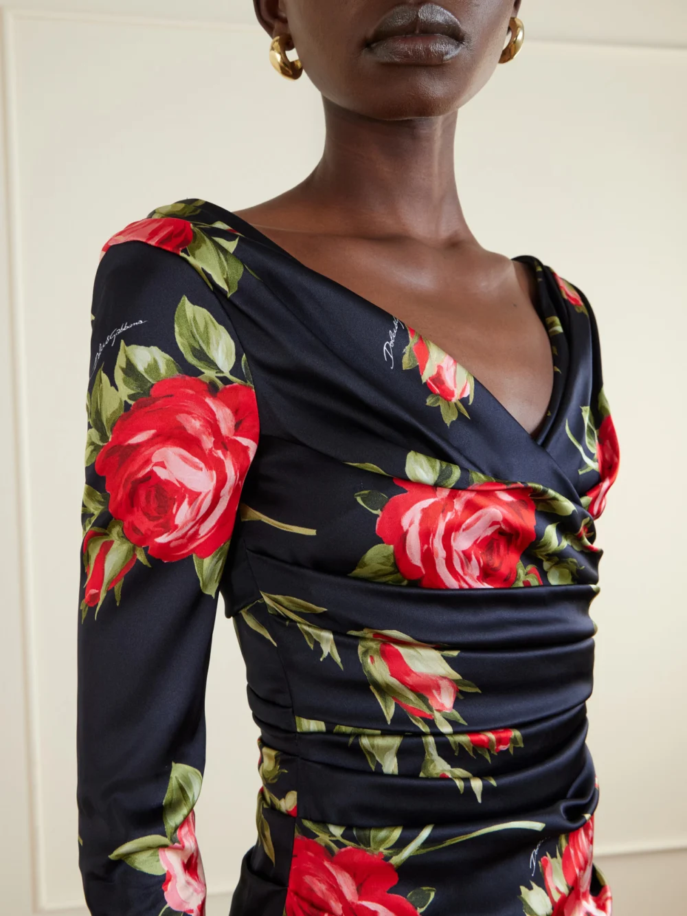 Close-up detail of the Dolce & Gabbana Ruched Floral-printed Satin Midi Dress