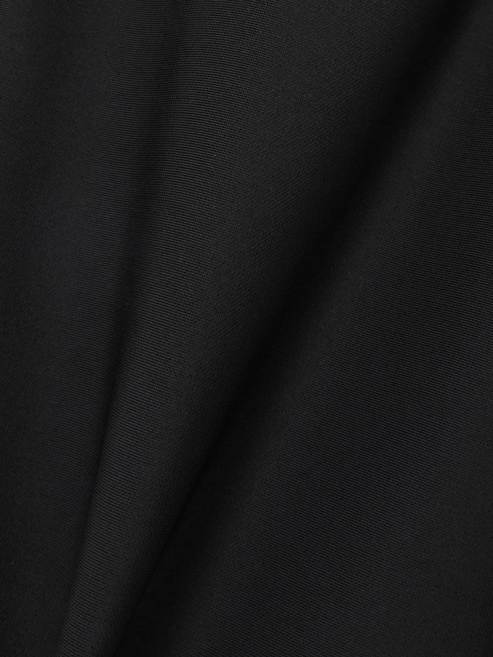 Close-up detail of the Dolce & Gabbana Shell-paneled Jersey Leggings