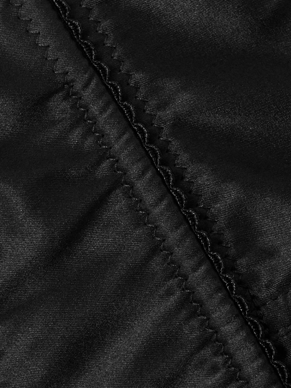 Close-up detail of the Dolce & Gabbana Silk-blend Satin Cone Bra