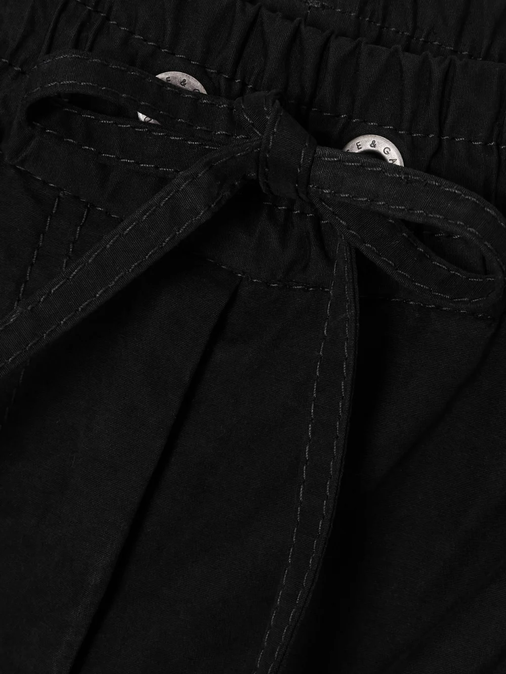 Close-up detail of the Dolce & Gabbana Tie-detailed Waxed-faille Cargo Pants