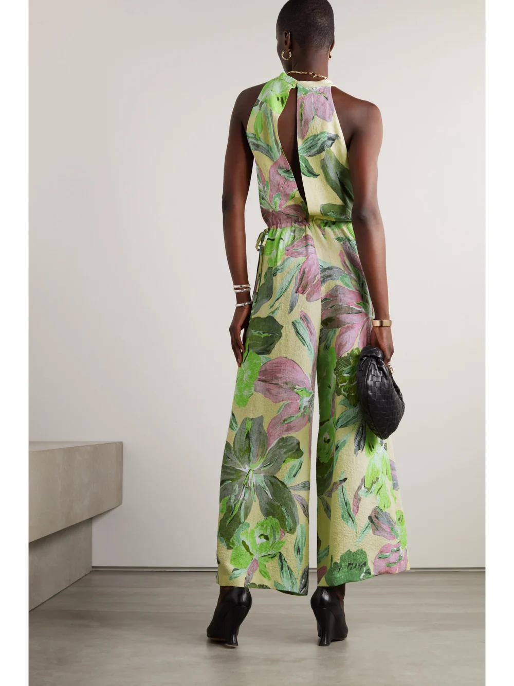 Back view of the Dries Van Noten Floral-print Cloqué Halterneck Jumpsuit