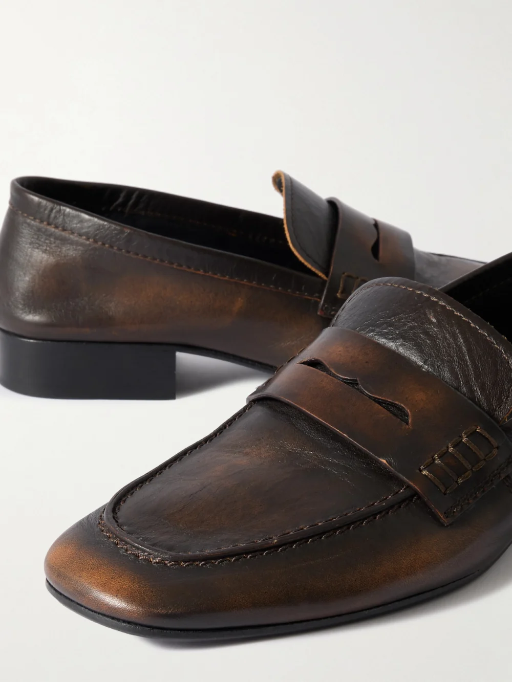 Close-up detail of the Dries Van Noten Glossed-leather Penny Loafers