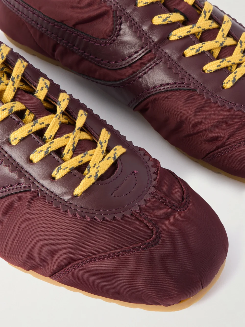 Close-up detail of the Dries Van Noten Leather-trimmed Shell Sneakers