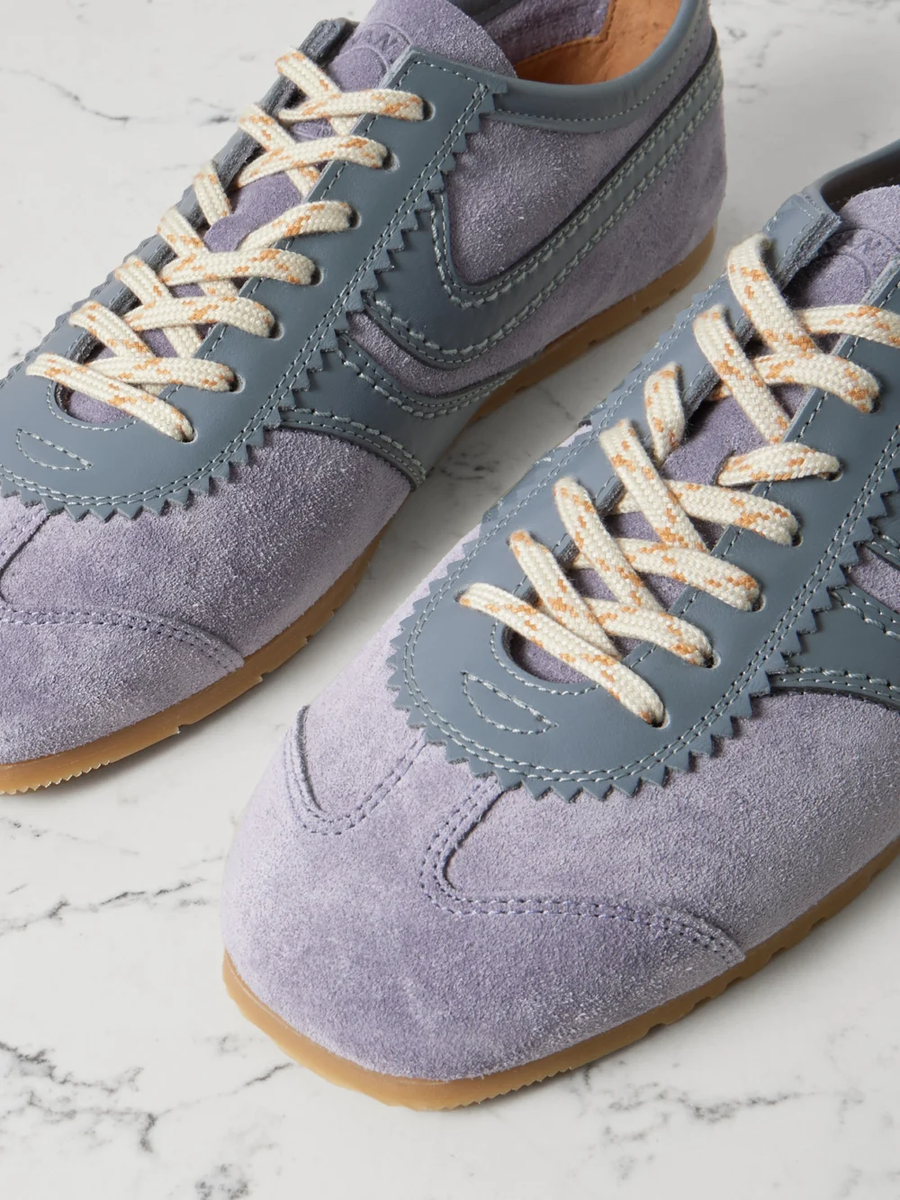 Close-up detail of the Dries Van Noten Leather-trimmed Suede Sneakers