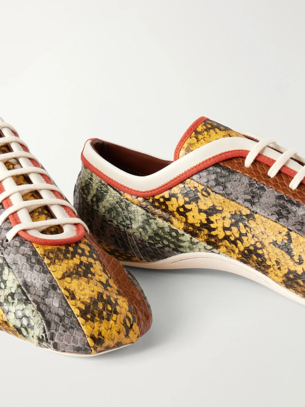 Close-up detail of the Dries Van Noten Striped Snake-effect Leather Sneakers
