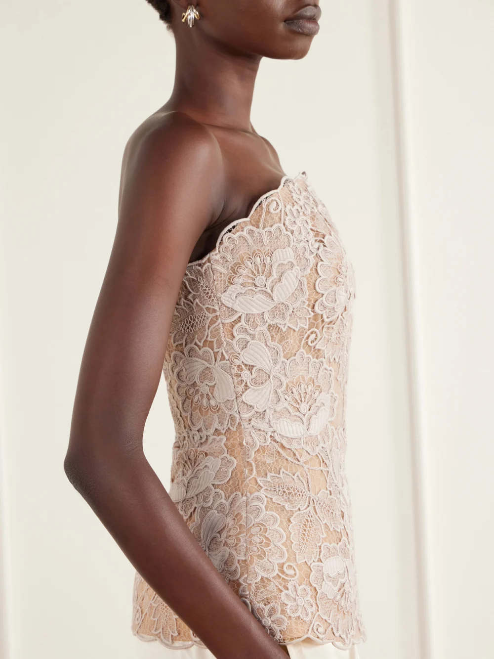 Close-up detail of the Elie Saab Scalloped Peplum Guipure Lace Bustier Top