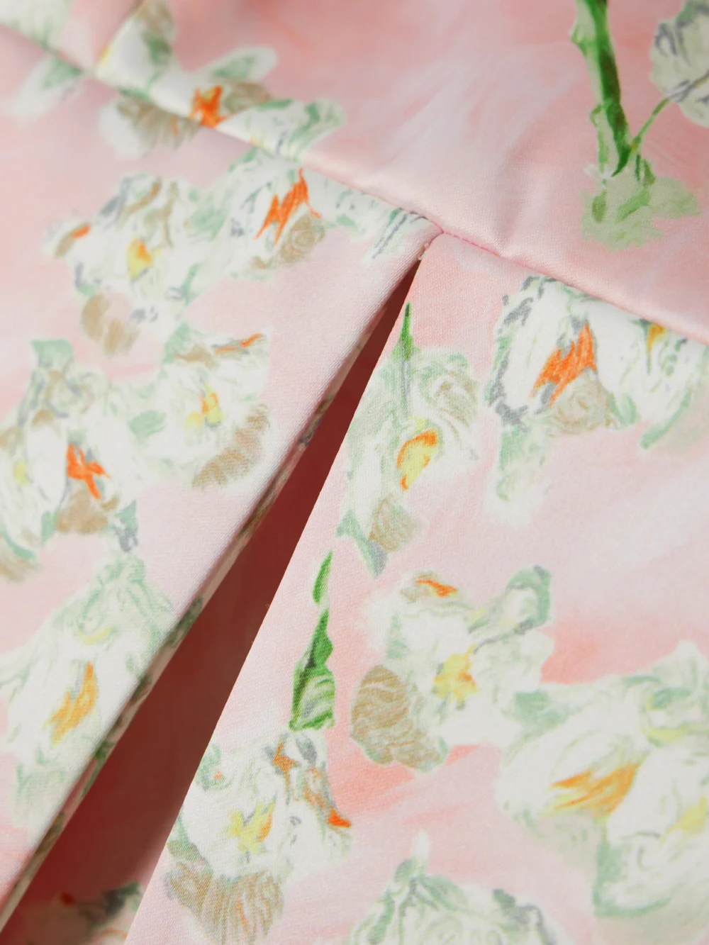Close-up detail of the Emilia Wickstead Levisa Pleated Floral-print Satin Mini Dress