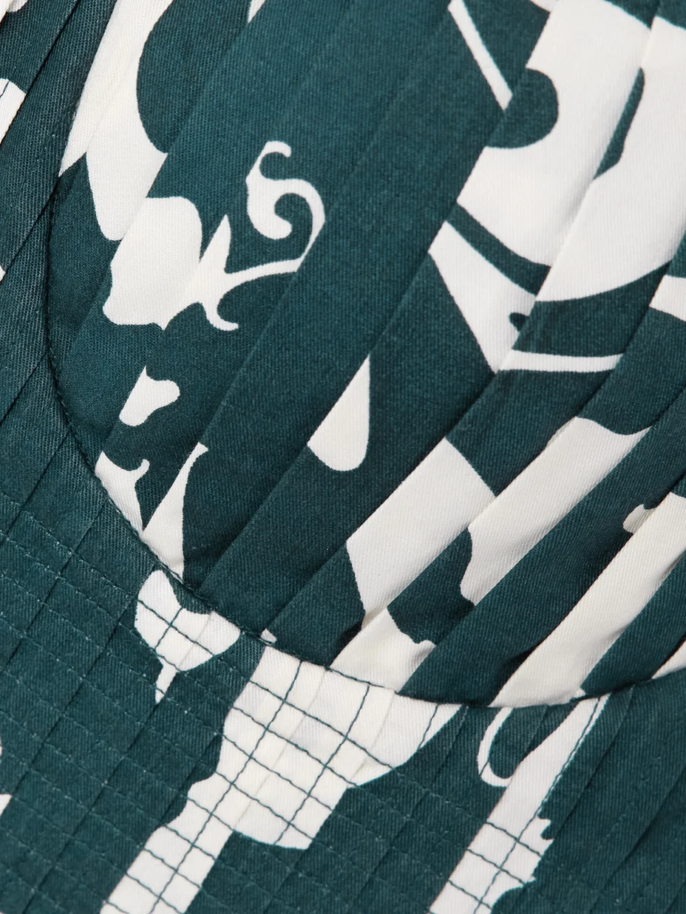 Close-up detail of the Emporio Sirenuse Dalia Pleated Frayed Floral-print Cotton Bustier Top